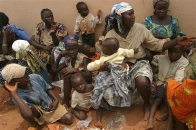 Displaced people seek refuge at a police station in Onitsha, Nigeria, Wednesday, Feb. 22, 2006. Bodies littered the streets of the southern Nigerian city of Onitsha on Wednesday as the death toll from days of Christian-Muslim violence across the volatile