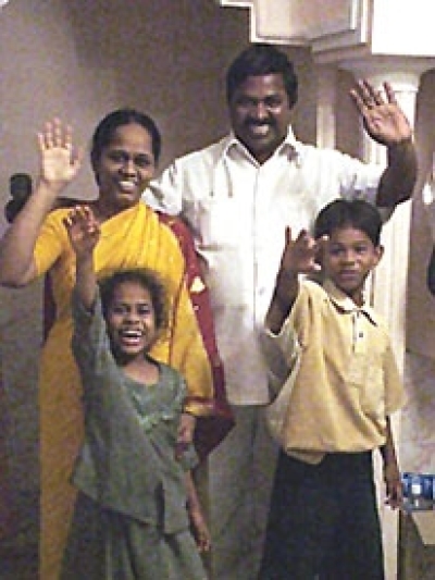 Pastor Joseph, the head of Mission of Joy in India, with his wife and children