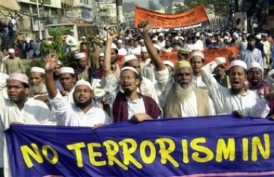 Bangladeshis shout slogans and march through a street during a rally condemning the recent spate of bomb attacks in the country, in Dhaka, Bangladesh, Friday, Dec. 9, 2005. Police questioned eight suspects Friday after a suicide bomber blew himself up on