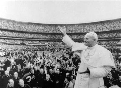 Pope John Paul II gestures to the crowd at New York's Shea Stadium after his arrival Oct. 3, 1979. (AP Photo/File)