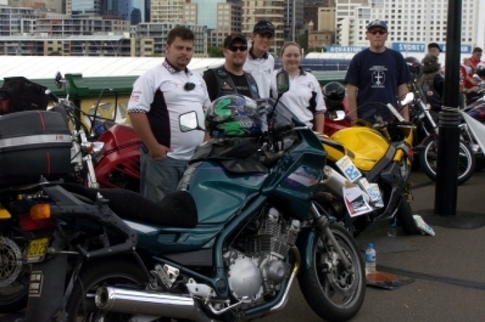 Members of the Christian Motorcyclists Association pose for a picture together at the kick-off of Motorcycle Awareness Week in this October 22, 2005 file photo. The group's mission is to encourage and conduct, among motorcyclists, public worship, ministry