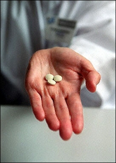 A nurse shows RU486 pills at a family planning clinic. 