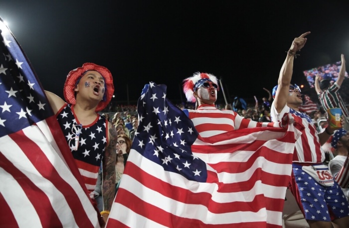 United States fans react to the women's semifinal match between Brazil and U.S.A. on Copacabana beach at the 2016 Rio Olympic Beach Volleyball Women's Semifinal USA vs. Brazil Beach Volleyball Arena Rio de Janeiro, Brazil, August 17, 2016.