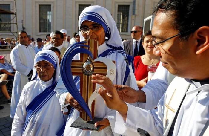 A nun, belonging to the global Missionaries of Charity, carries a relic of Mother Teresa of Calcutta before a mass celebrated by Pope Francis for her canonisation in Saint Peter's Square at the Vatican.