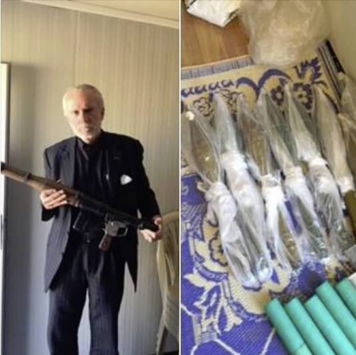 Pastor Bill Devlin poses with weapons he bought for the Nineveh Plains Protection Unit in Iraq in a photo that was taken in April 2016.