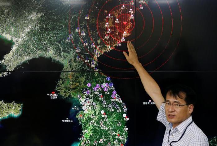 Ryoo Yong-gyu, Earthquake and Volcano Monitoring Division Director, points at where seismic waves observed in South Korea came from, during a media briefing at Korea Meteorological Administration in Seoul, South Korea, September 9, 2016.