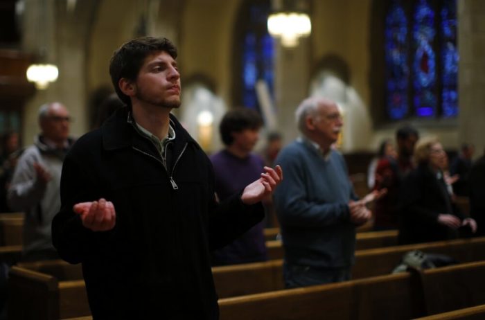 Faithful attend a Thanksgiving Mass for newly elected Pope Francis at Saint Ignatius church in Newton, Massachusetts March 19, 2013.