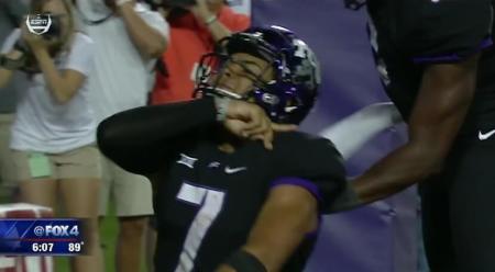 Texas Christian University quarterback Kenny Hill celebrates a touchdown by performing the 'Rising Kings' sign language gesture during the Horned Frogs game against the University of Arkansas on Sept. 10, 2016.