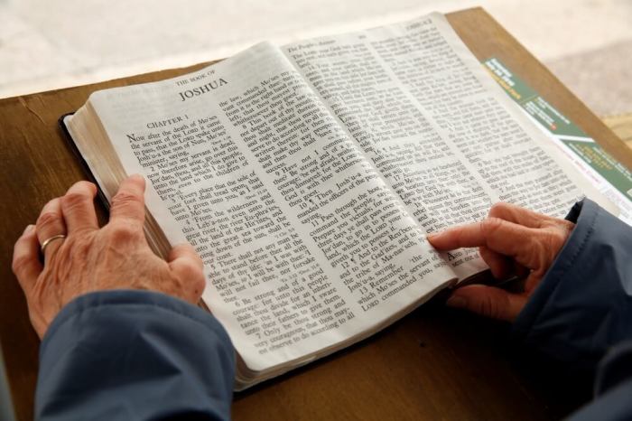 A woman reads from the Book of Joshua during the 27th Annual U.S. Capitol Bible Reading Marathon in Washington, May 2, 2016.