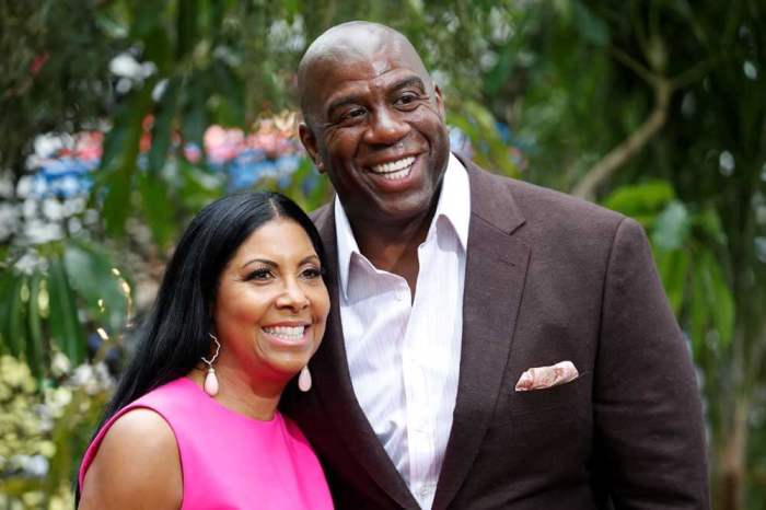 Former NBA basketball player Earvin Magic Johnson (R) and his wife, Cookie Johnson, pose at the premiere of the movie 'The Legend of Tarzan' in Hollywood, California, June 27, 2016.