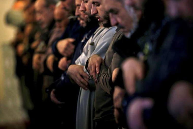 Members of the Muslim community pray in a mosque in Marseille during an open day weekend for mosques in France, January 9, 2016.