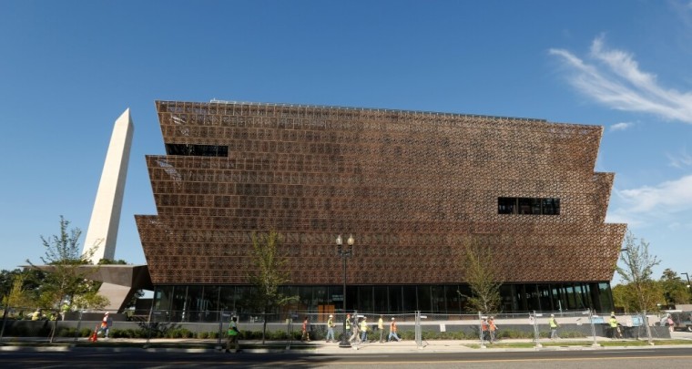 The Washington Monument rises behind the National Museum of African American History and Culture on the National Mall in Washington September 14, 2016. The museum is holding a media preview today ahead of its opening day on September 24.