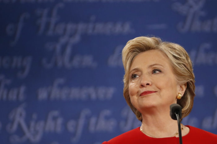 Democratic U.S. presidential nominee Hillary Clinton listens during the first presidential debate with Republican U.S. presidential nominee Donald Trump at Hofstra University in Hempstead, New York, U.S., September 26, 2016.