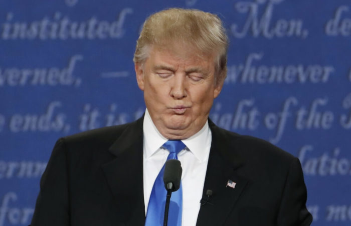 Republican U.S. presidential nominee Donald Trump reacts during the first presidential debate with Democratic U.S. presidential nominee Hillary Clinton at Hofstra University in Hempstead, New York, U.S., September 26, 2016.