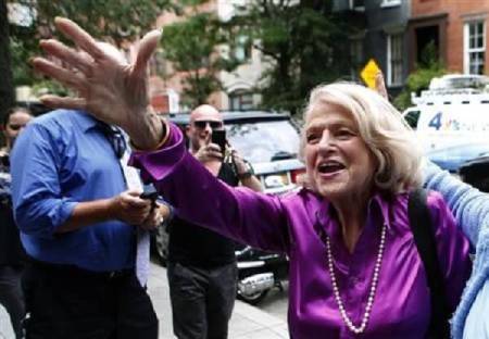 Edith ''Edie'' Windsor (C) reacts to cheers as she arrives for a news conference following the U.S. Supreme Court 5-4 ruling striking down as unconstitutional the Defense of Marriage Act, in New York June 26, 2013.