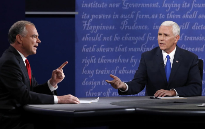 Democratic U.S. vice presidential nominee Senator Tim Kaine (L) and Republican U.S. vice presidential nominee Governor Mike Pence discuss an issue during their vice presidential debate at Longwood University in Farmville, Virginia, U.S., October 4, 2016.