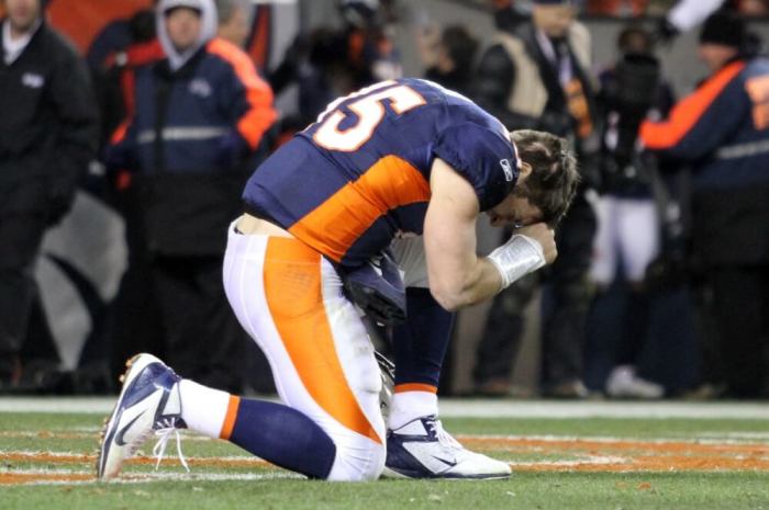 Denver Broncos quarterback Tim Tebow prays after the Broncos defeated the Pittsburgh Steelers in overtime in the NFL AFC wildcard playoff football game in Denver, Colorado, January 8, 2012.