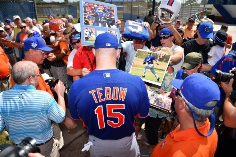 New York Mets outfielder Tim Tebow (15) signs autographs for fans after his workout at the Mets Minor League Complex, Port St. Lucie, Florida, September 20, 2016.