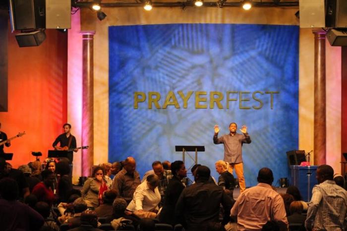 David Ireland, founding pastor of the multi-campus Christ Church, headquartered in Rockaway, New Jersey, greets his congregation at PrayerFest on Friday, October 21, 2016.