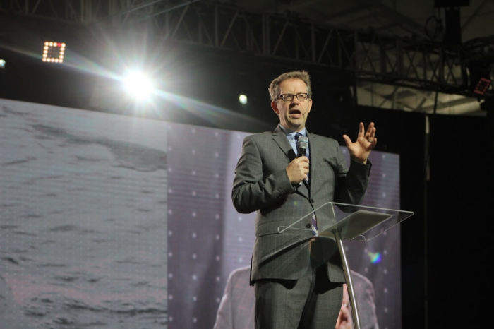 The Rev. Dr. McKenzie 'Mac' Pier, founder and CEO of The New York Leadership Center welcomes attendees at the Jacob Javits Center in Manhattan, New York on Tuesday October 25, 2016 on the opening day of Movement Day Global Cities.