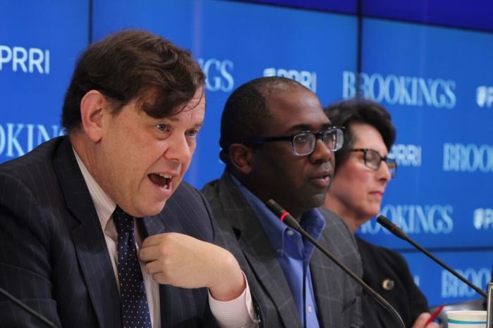 Ethics & Public Policy Center's Henry Olsen (L) speaks during a panel discussion during the rollout of the Public Religion Research Institute's 2016 American Values Survey at the Bookings Institution in Washington, D.C. on Oct. 25, 2016. NBC News' Perry Bacon Jr. (M) and American Enterprise Institute's Karlyn Bowman (R) also participated in the discussion.