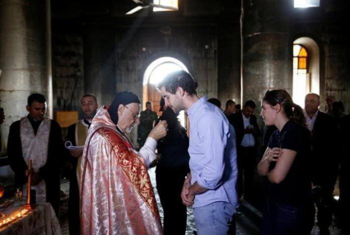 Iraqi priests hold the first Sunday mass at the Grand Immaculate Church since it was recaptured from Islamic State in Qaraqosh, near Mosul, Iraq, October 30, 2016.