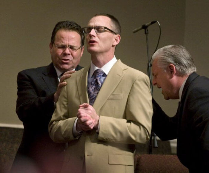 Senior Pastor of New Life United Pentecostal Church in Austin, Texas, Rodney Shaw (C) receives prayer from elders in the United Pentecostal Church in 2011.