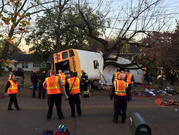 Rescue officials at the scene of a school bus crash involving several fatalities in Chattanooga, Tennessee, November 21, 2016.