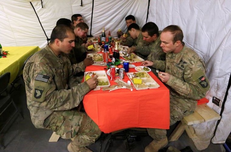 U.S. soldiers eat their meals to celebrate Thanksgiving Day inside the U.S. army base in Qayyara, south of Mosul, Iraq November 24, 2016.