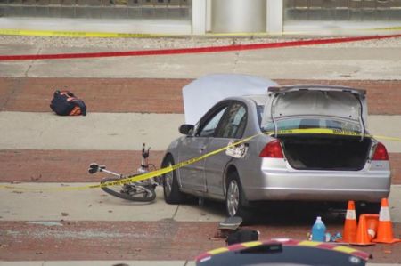 A car which police say was used by an attacker to plow into a group of students is seen outside Watts Hall on Ohio State University's campus in Columbus, Ohio.