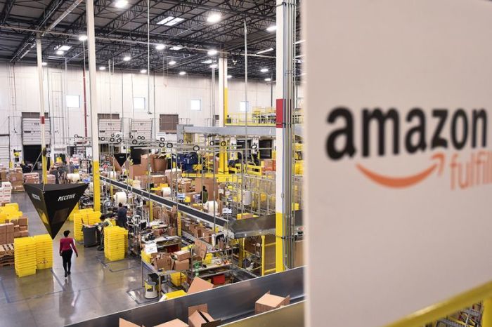 Workers process incoming items at an Amazon Fulfillment Center on Cyber Monday in Tracy, California, November 28, 2016.