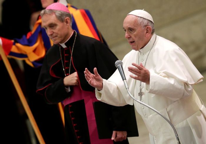 Pope Francis talks as he leads the general audience in Paul VI Hall at the Vatican December 7, 2016.