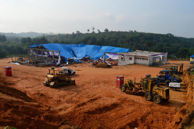 Heavy duty equipment and machinery are seen at the premises of the collapsed church in Uyo, Nigeria Dec.11, 2016.