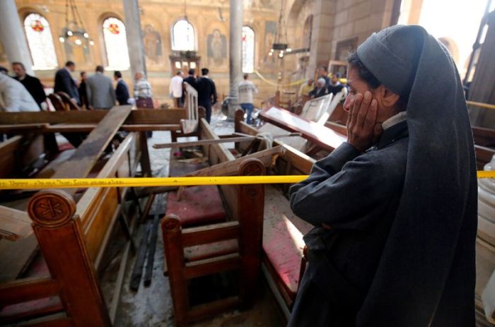 A nun cries as she stands at the scene inside Cairo's Coptic cathedral, following a bombing, in Egypt December 11, 2016.