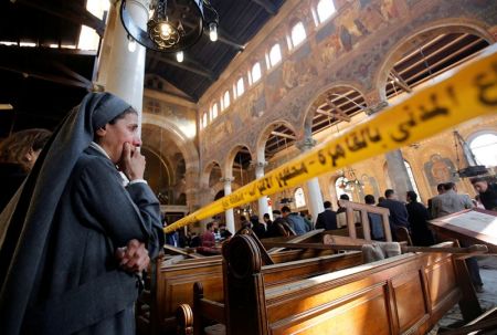 A nun cries as she stands at the scene inside Cairo's Coptic cathedral, following a bombing, in Egypt December 11, 2016.