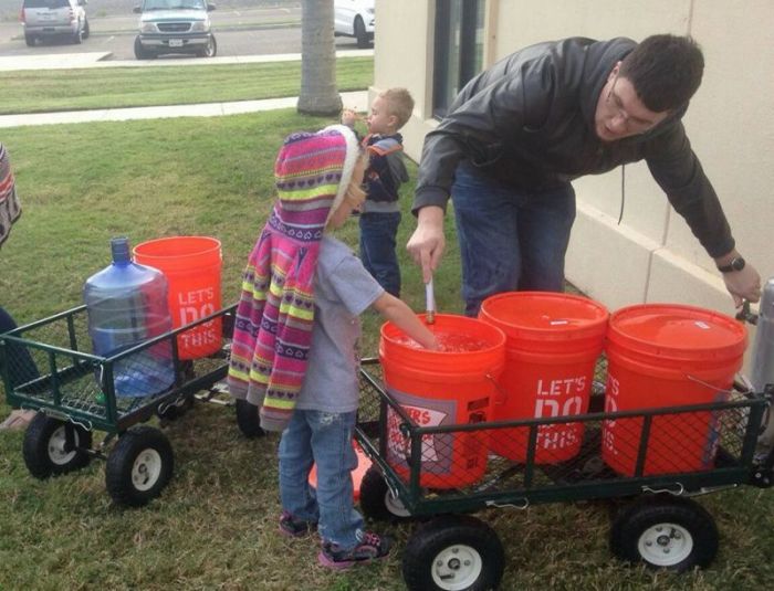 First United Methodist Church of Portland, Texas gives away water to residents of Corpus Christi, Texas on Thursday, December 15, 2016.