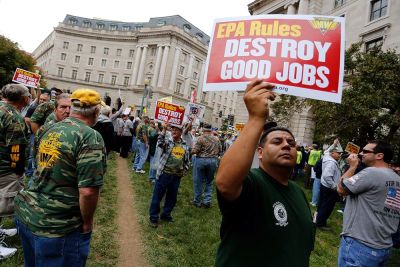 Members of the United Mine Workers of America hold a rally outside the U.S. Environmental Protection Agency headquarters in Washington October 7, 2014. The union members rallied against proposed EPA Clean Power Plan rules, which the union claims will eliminate thousands of coal industry-related jobs.