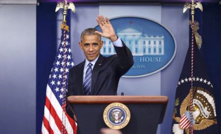 U.S. President Barack Obama waves as he leaves the podium after speaking to journalists during his last news conference of the year at the White House in Washington, U.S., December 16, 2016.