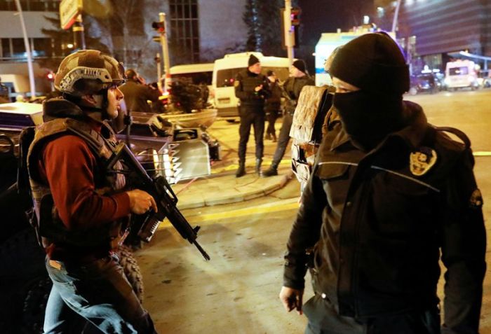 Turkish police secure the area near an art gallery where the Russian Ambassador to Turkey Andrei Karlov was shot in Ankara, Turkey, December 19, 2016.