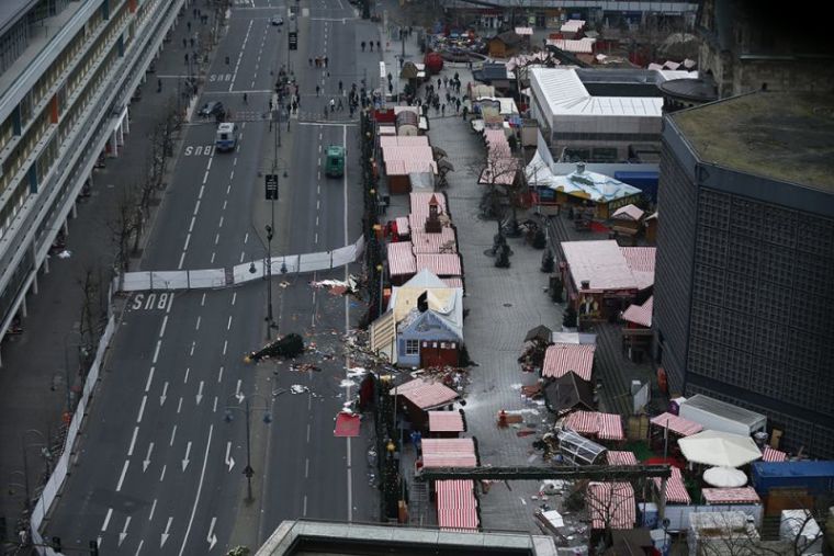 A christmas tree lays on the street beside the empty Christmas market in Berlin, Germany, December 21, 2016, after a truck ploughed through a crowd at the Christmas market on Monday night.