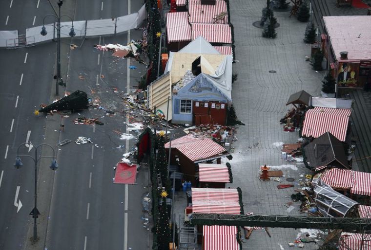 A christmas tree lays on the street beside the empty Christmas market in Berlin, Germany, December 20, 2016, after a truck ploughed through a crowd at the Christmas market on Monday night.