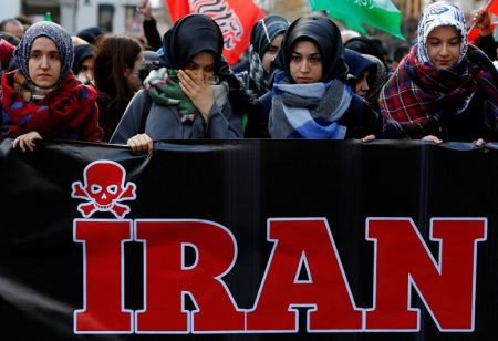 Demonstrators march with a banner during a protest against Iran's role in Aleppo, near the Iranian Consulate in Istanbul, Turkey, December 16, 2016.