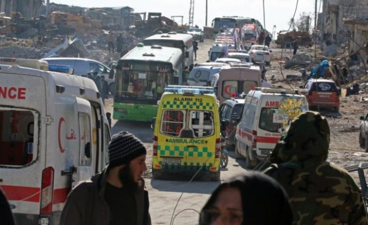 Ambulances and buses wait as they evacuate people from a rebel-held sector of eastern Aleppo, Syria December 15, 2016.