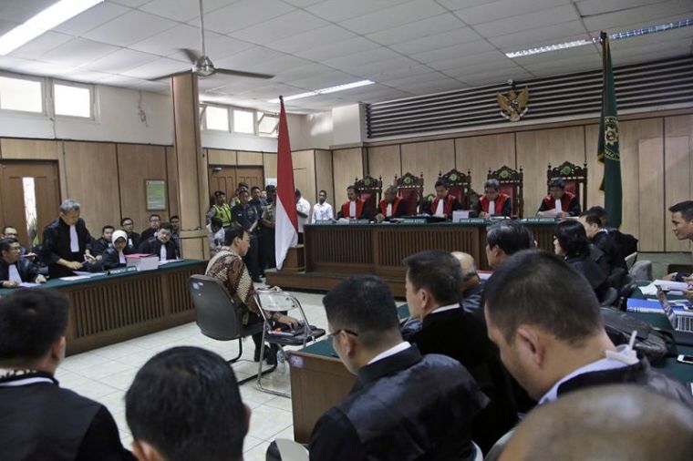 Jakarta Governor Basuki Tjahaja Purnama, popularly known as Ahok, sits on the defendant's chair at the start of his trial hearing at North Jakarta District Court in Jakarta, Indonesia, December 13, 2016.