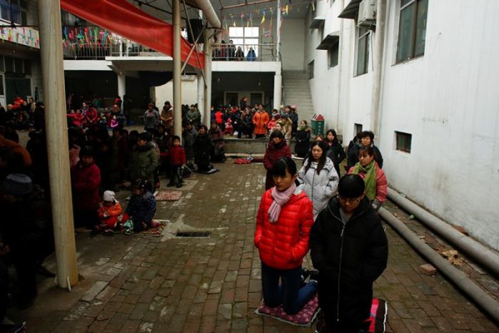 People attend Sunday service at a makeshift, tin-roofed church in Youtong village, Hebei Province, China, December 11, 2016.