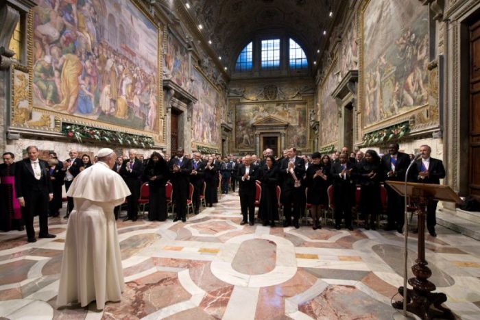 Pope Francis arrives to attend an audience with the diplomatic corps accredited to the Holy See for the traditional exchange of New Year greetings at the Vatican January 9, 2017.