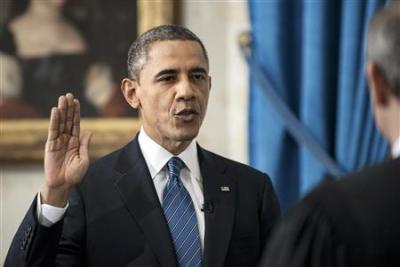 U.S. President Barack Obama takes the official oath of office from U.S. Supreme Court Chief Justice John Roberts, as Obama is sworn in for his second term as the 44th President of the United States, at the White House in Washington January 20, 2013.