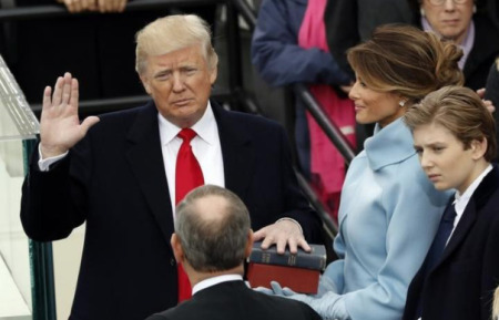 U.S. President Donald Trump (L) takes the oath of office from U.S. Supreme Court Chief Justice John Roberts (R) with his wife Melania, and children Barron, Donald, Ivanka and Tiffany at his side during inauguration ceremonies at the Capitol in Washington, U.S., January 20, 2017.