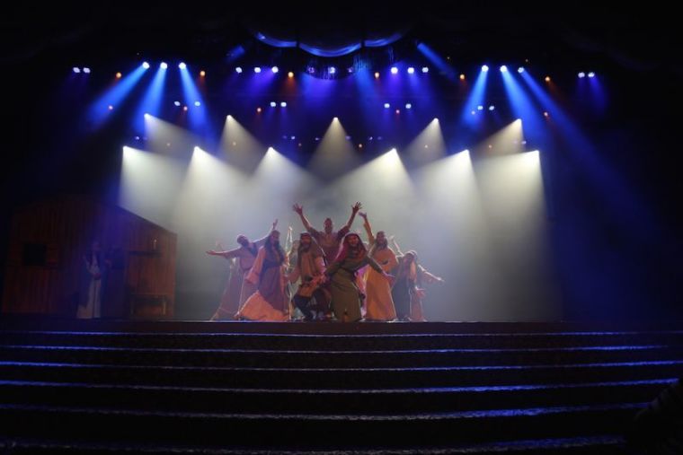 Actors at the Holy Land Experience pose at the conclusion of a song, 2106.