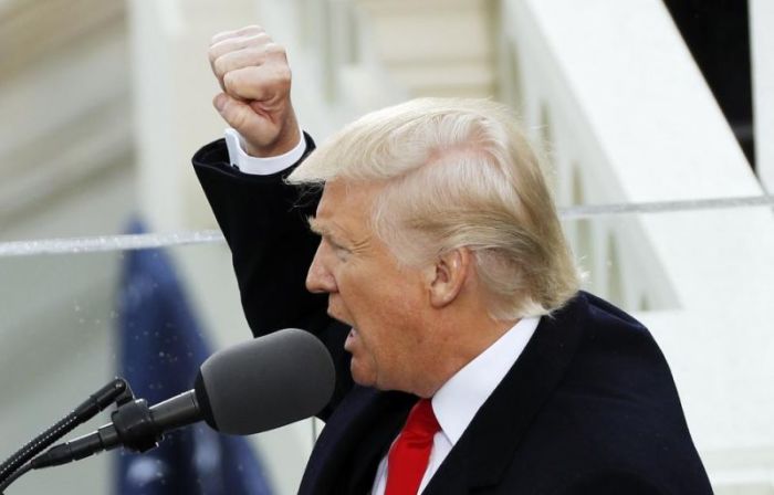 President Donald Trump speaks to the assembled crowd outside the US Capitol after taking the Oath of Office on Friday, January 20.